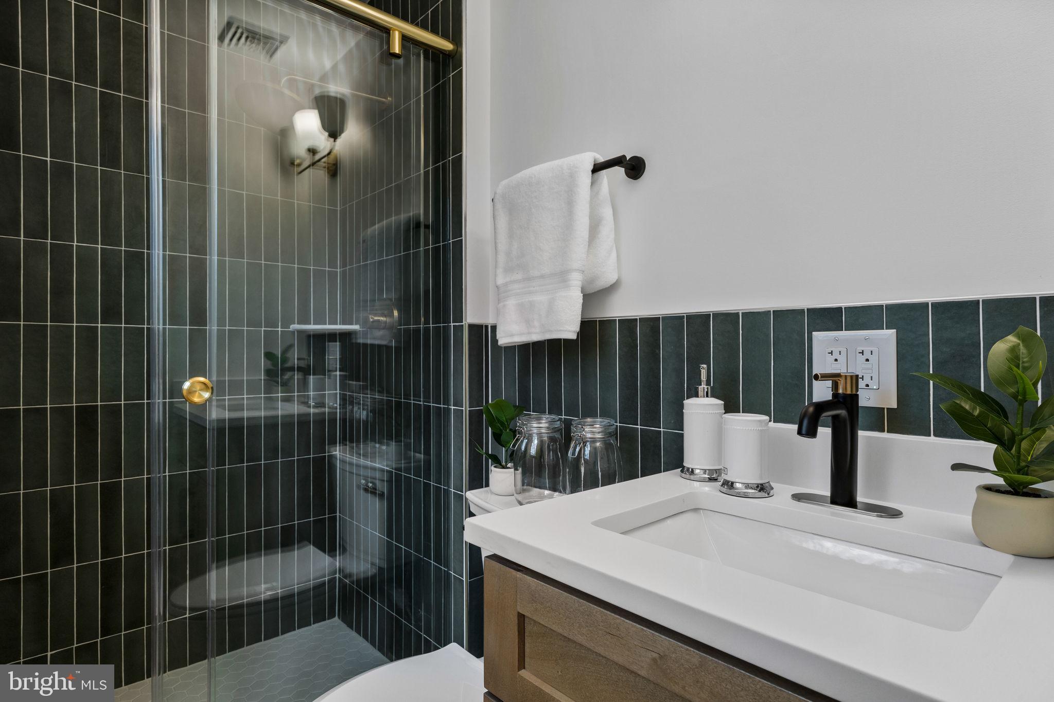 1189 Foxview Road Pottstown, PA 19465 - Photo 35 of 58 a bathroom with a sink a toilet and shower