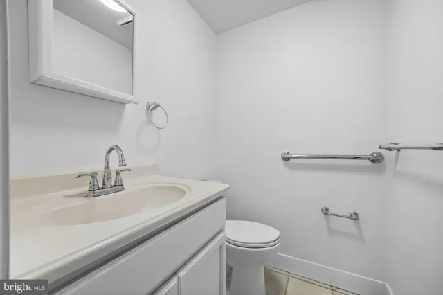 a view of a pathway of a house with a yard