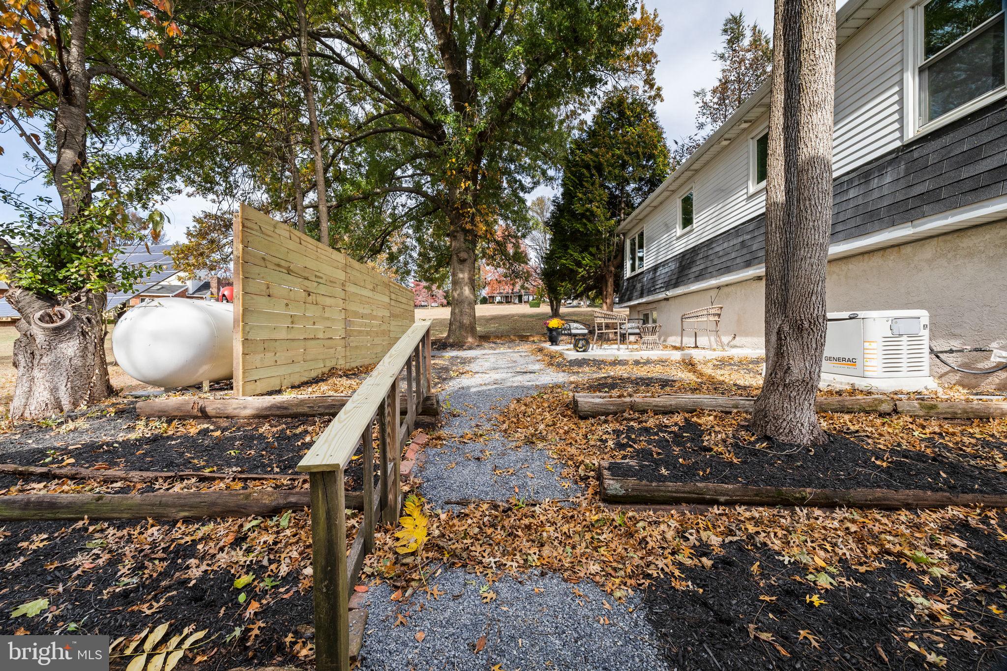 1189 Foxview Road Pottstown, PA 19465 - Photo 47 of 58 a view of a pathway of a house with a yard