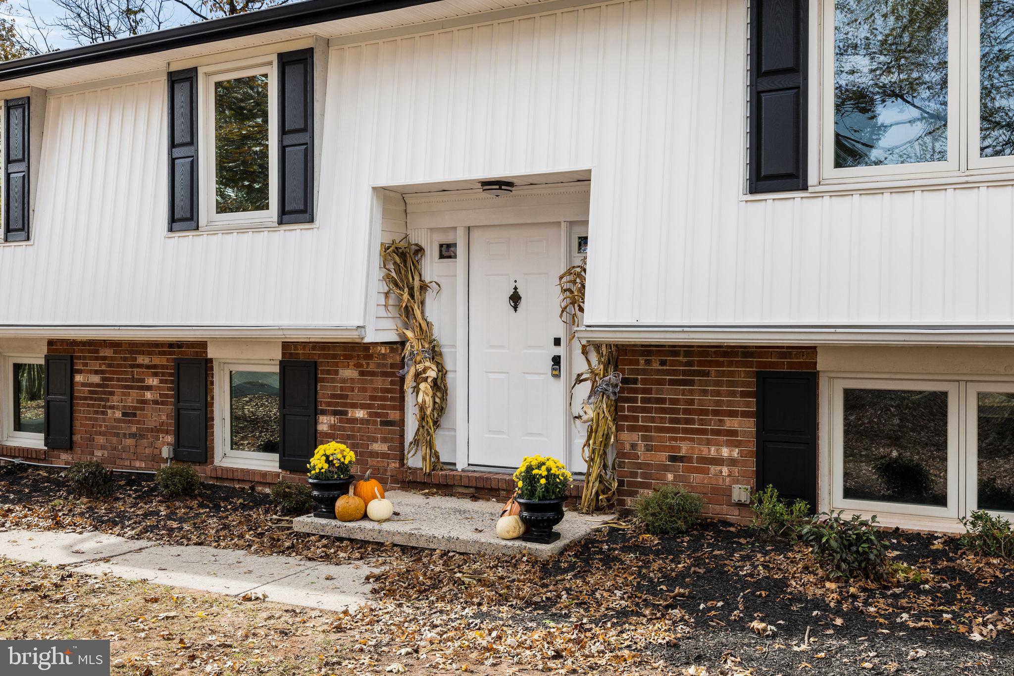 1189 Foxview Road Pottstown, PA 19465 - Photo 5 of 58 a front view of a house with patio