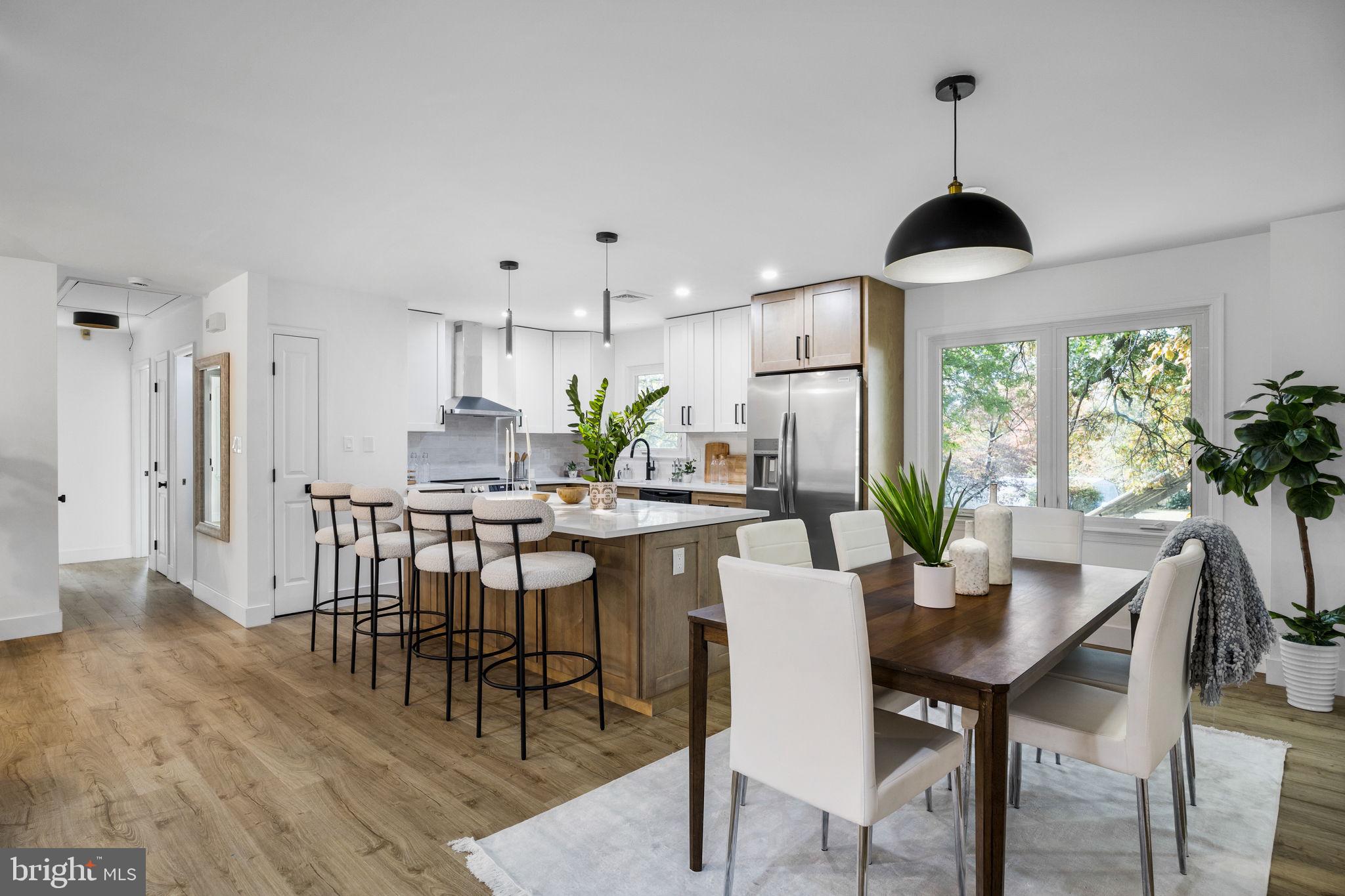 1189 Foxview Road Pottstown, PA 19465 - Photo 6 of 58 a dining room with furniture a chandelier and wooden floor