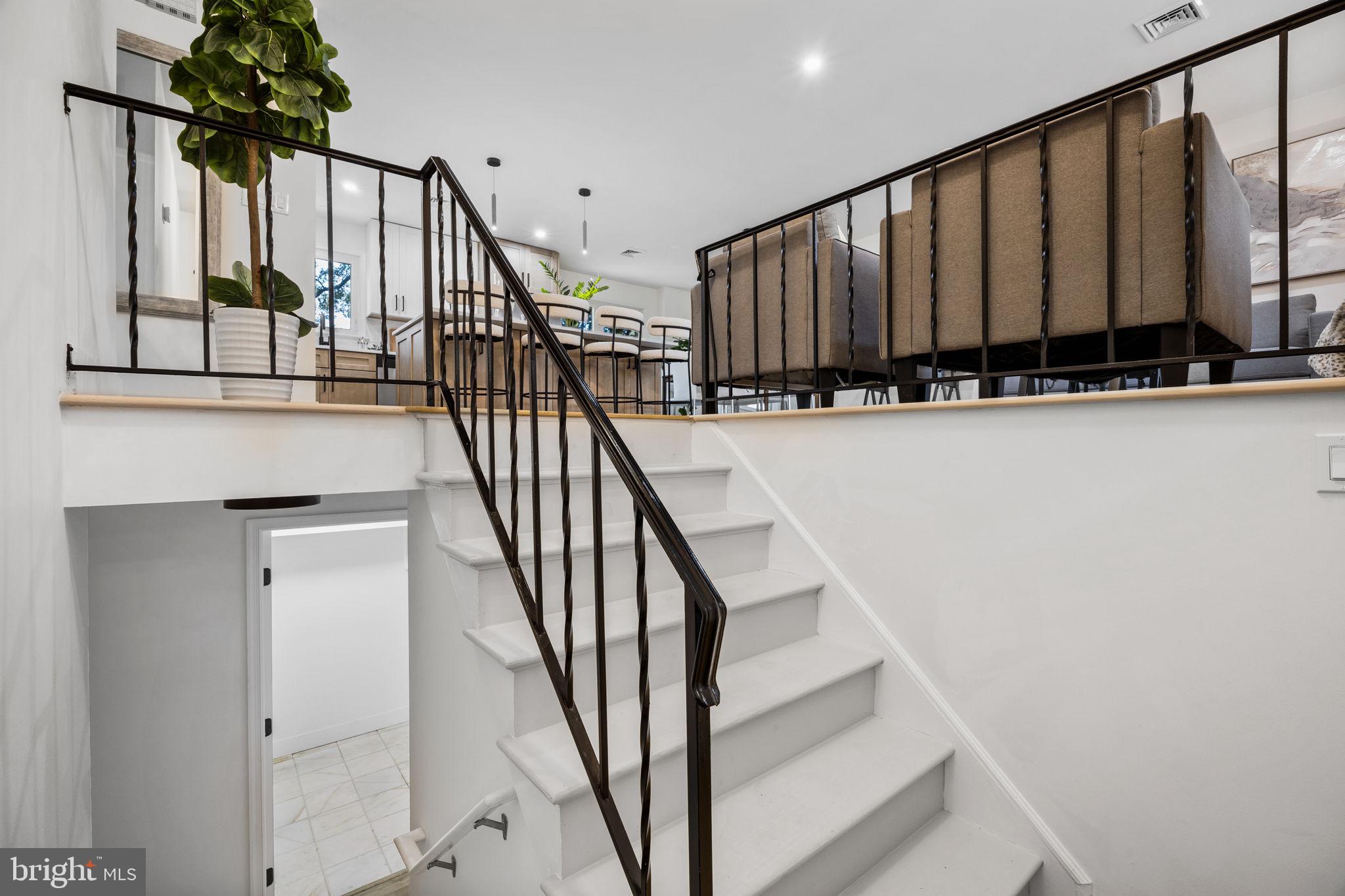 1189 Foxview Road Pottstown, PA 19465 - Photo 7 of 58 a view of staircase with wooden floor and a potted plant