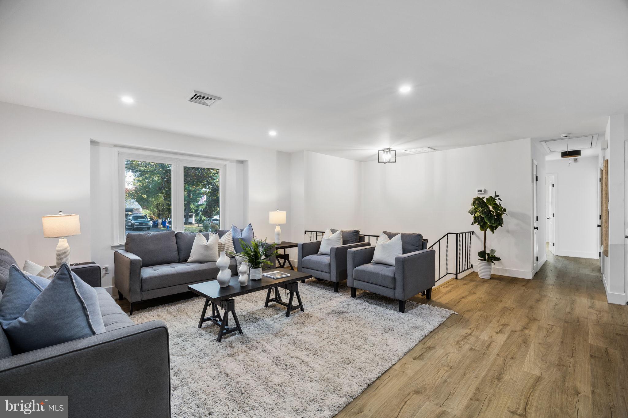 1189 Foxview Road Pottstown, PA 19465 - Photo 9 of 58 a living room with furniture potted plant and a window