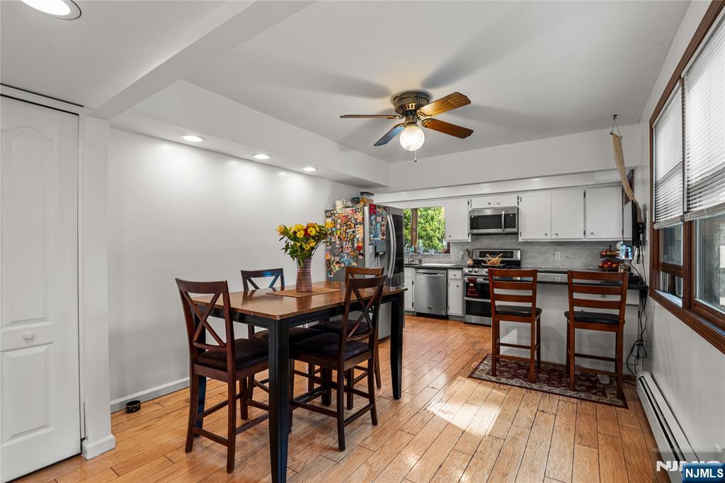 767-773 Ravine Road Plainfield, NJ 07062 - Photo 13 of 38 a view of a dining room with furniture and a wooden floor