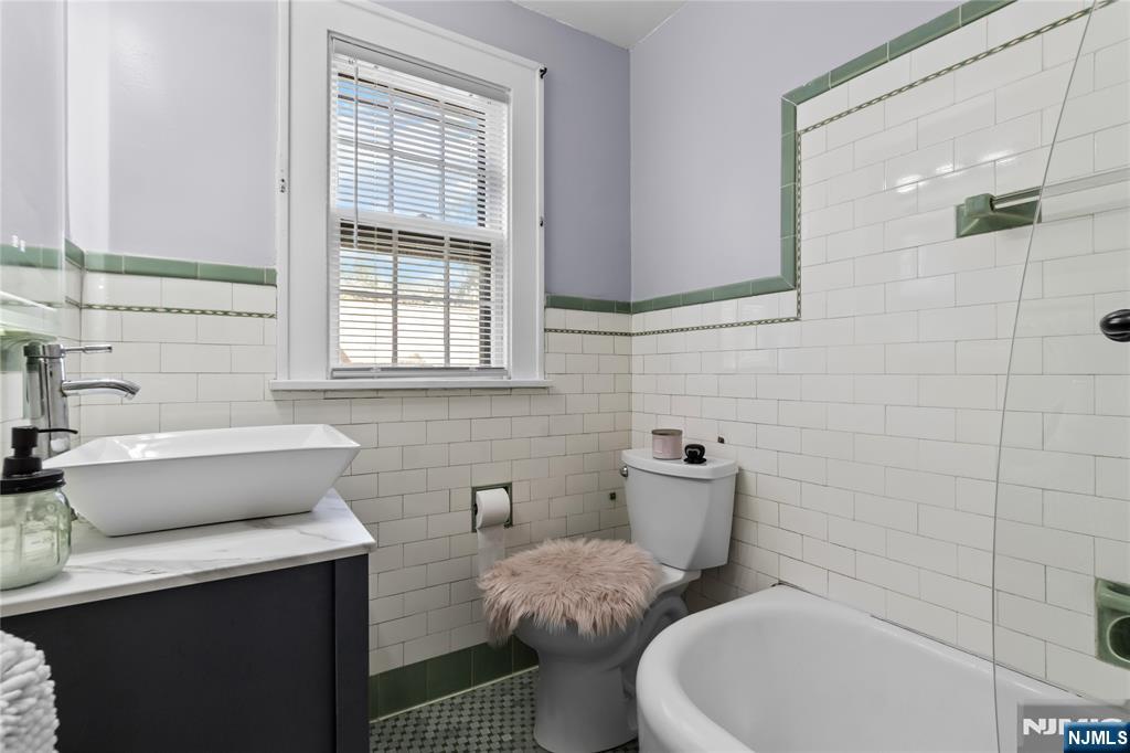 767-773 Ravine Road Plainfield, NJ 07062 - Photo 17 of 38 a bathroom with a toilet sink and mirror