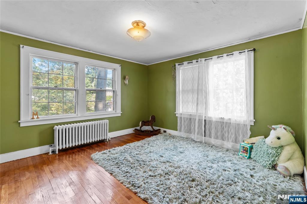 767-773 Ravine Road Plainfield, NJ 07062 - Photo 20 of 38 a bedroom with a bed and wooden floor