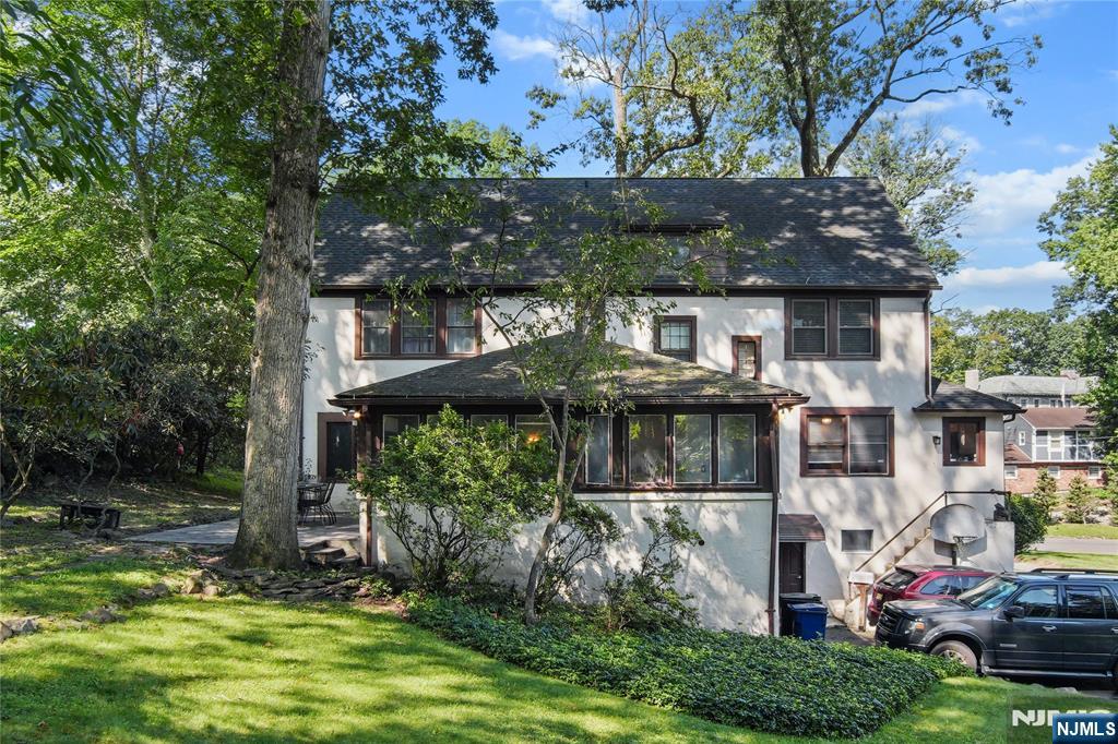 767-773 Ravine Road Plainfield, NJ 07062 - Photo 2 of 38 a front view of a house with a garden