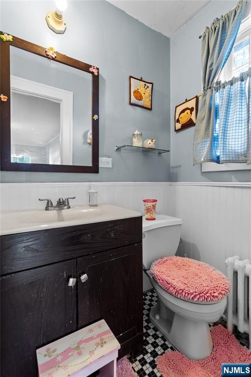 767-773 Ravine Road Plainfield, NJ 07062 - Photo 23 of 38 a bathroom with a sink a toilet and a mirror