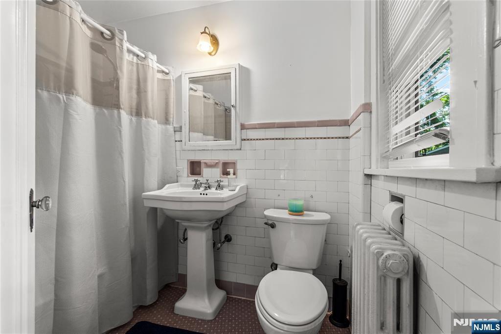 767-773 Ravine Road Plainfield, NJ 07062 - Photo 26 of 38 a bathroom with a sink a toilet and shower