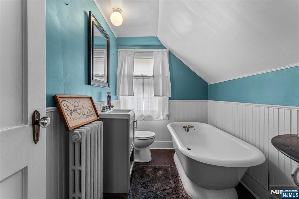 767-773 Ravine Road Plainfield, NJ 07062 - Photo 28 of 38 a bathroom with a toilet a sink and mirror