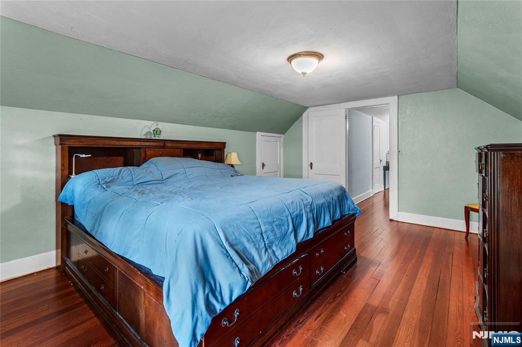 767-773 Ravine Road Plainfield, NJ 07062 - Photo 30 of 38 a bedroom with a bed and wooden floor