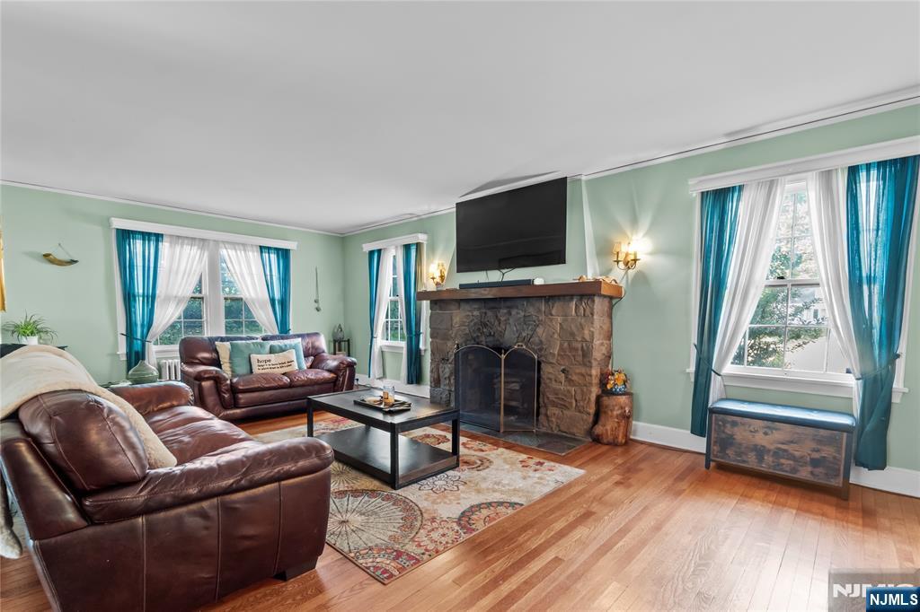 767-773 Ravine Road Plainfield, NJ 07062 - Photo 4 of 38 a living room with furniture a flat screen tv and a fireplace