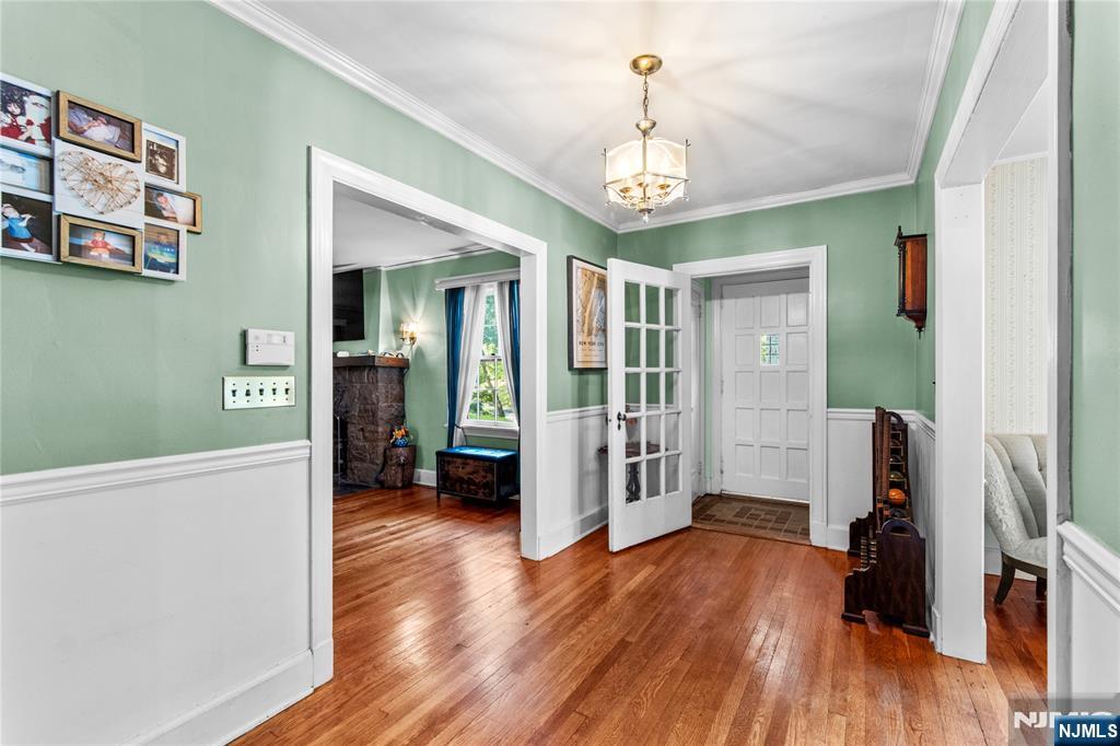 767-773 Ravine Road Plainfield, NJ 07062 - Photo 7 of 38 a view of a hallway with wooden floor and livingroom with furniture