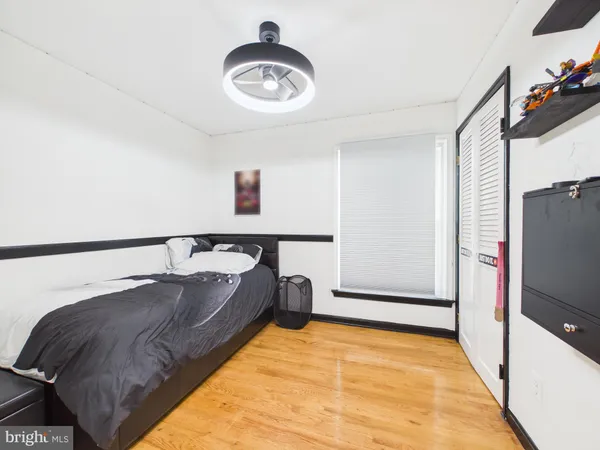 a bathroom with a sink vanity mirror and toilet