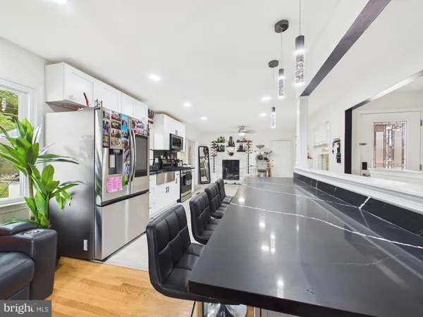 a view of a living room and kitchen