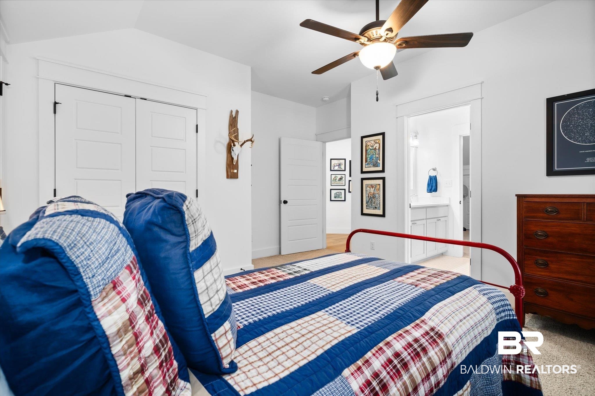 15 Semmes Avenue Mobile, AL 36604 - Photo 23 of 43 Bedroom with carpet, ensuite bath, vaulted ceiling, ceiling fan, and a closet