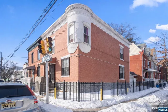 a view of a brick building with many windows