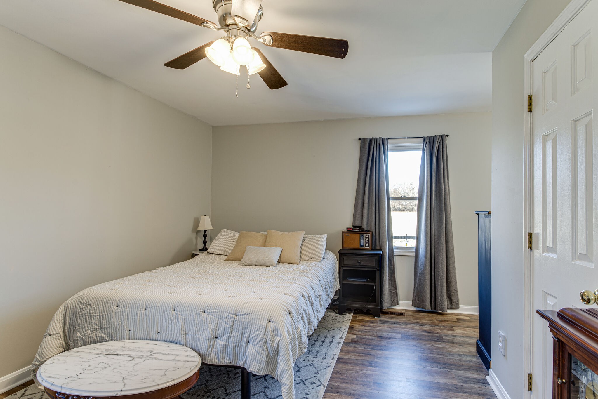 298 Flowertown Road Normandy, TN 37360 - Photo 16 of 34 a bedroom with a bed and a chandelier