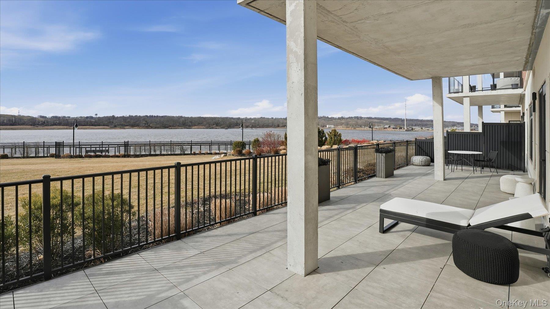 10 Shore Road, Unit 108 Glenwood Landing, NY 11547 - Photo 13 of 20 a view of balcony with couch and chairs