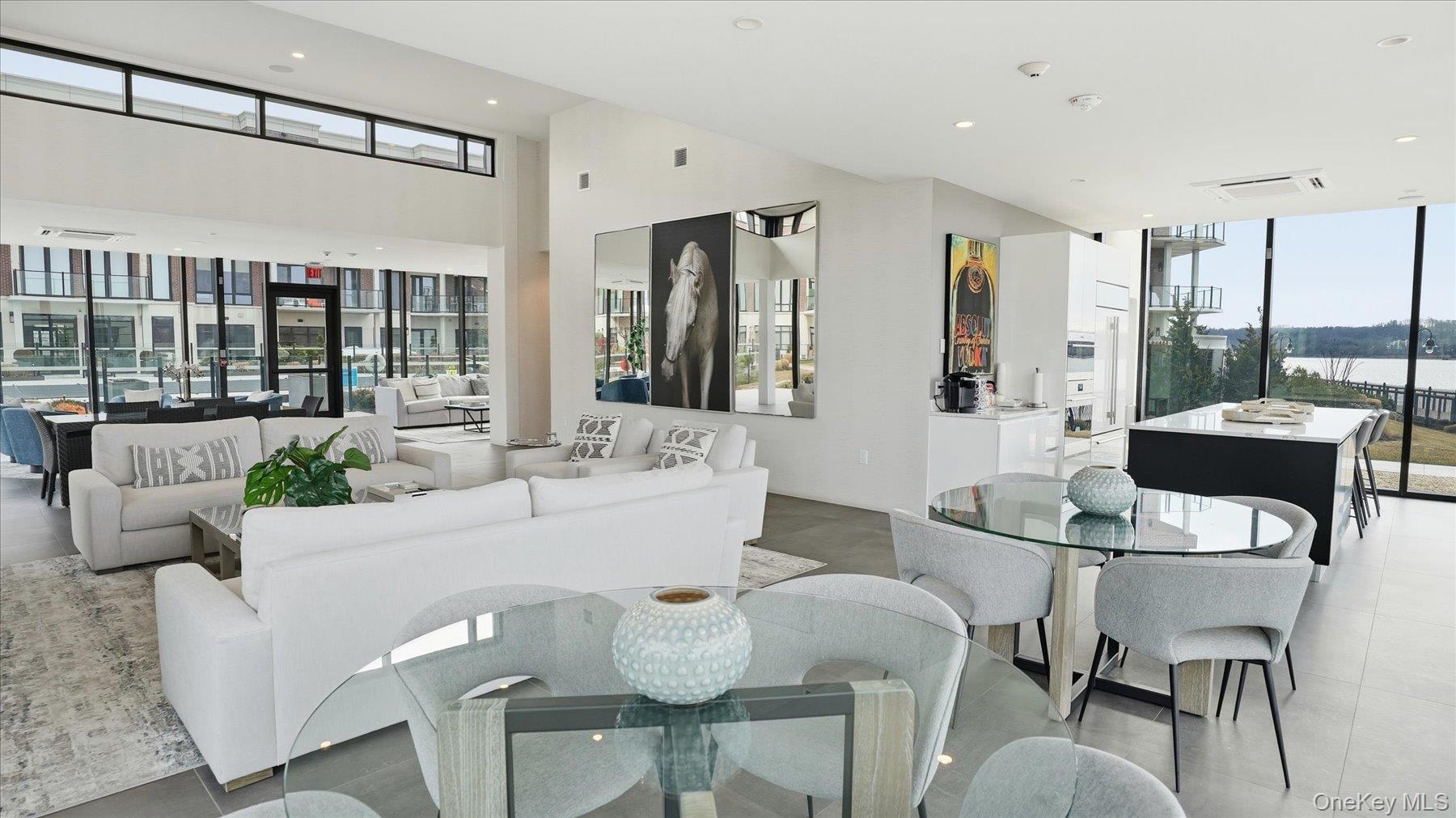 10 Shore Road, Unit 108 Glenwood Landing, NY 11547 - Photo 18 of 20 a living room with furniture and a table