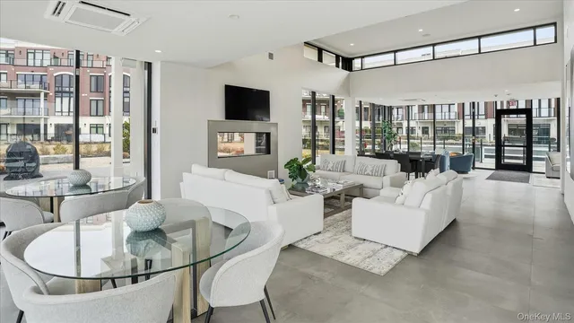 a picture of a room with a white wall and has a large mirror