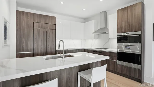 a kitchen with a sink a stove and cabinets