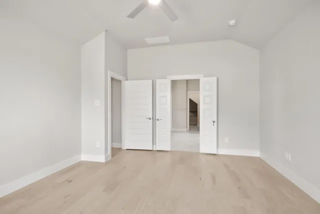 an empty room with closet area