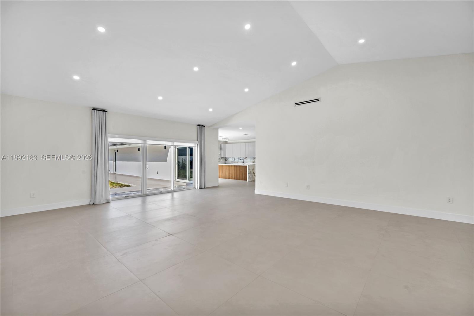 1200 Southwest 23rd Court Miami, FL 33135 - Photo 12 of 36 a view of a big room with wooden floor and windows