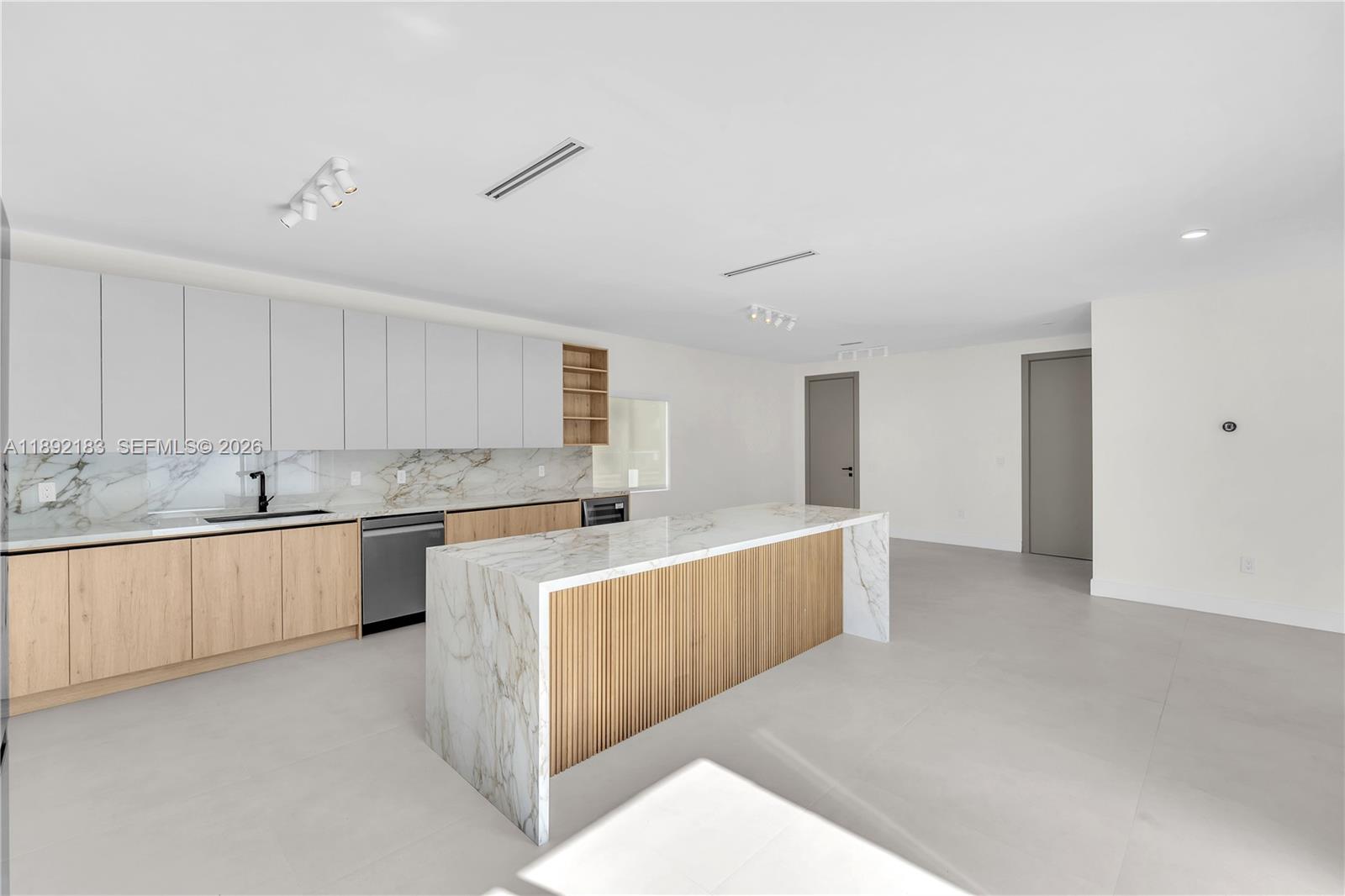 1200 Southwest 23rd Court Miami, FL 33135 - Photo 16 of 36 a large white kitchen with cabinets