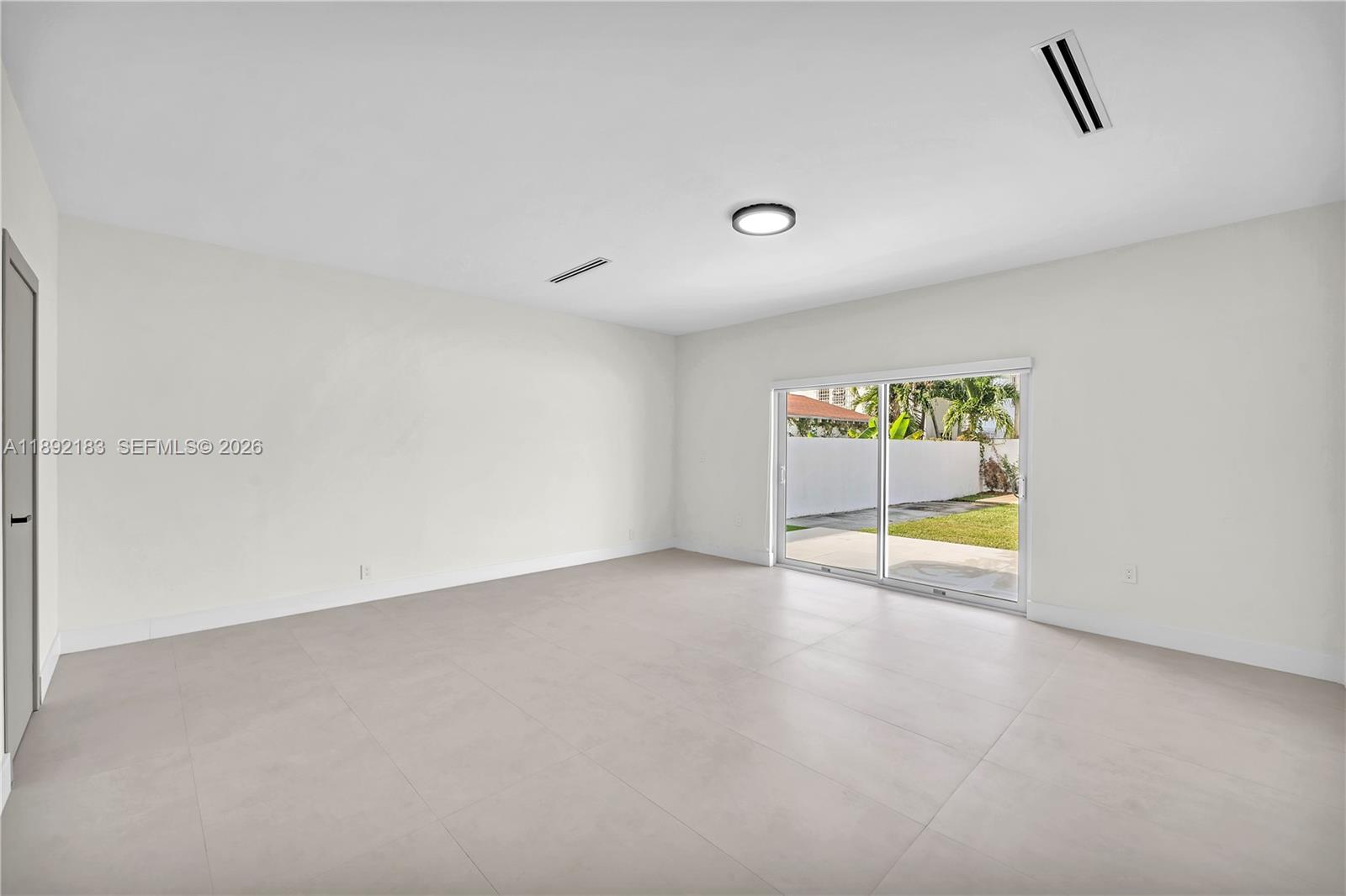 1200 Southwest 23rd Court Miami, FL 33135 - Photo 18 of 36 a view of an empty room with a window