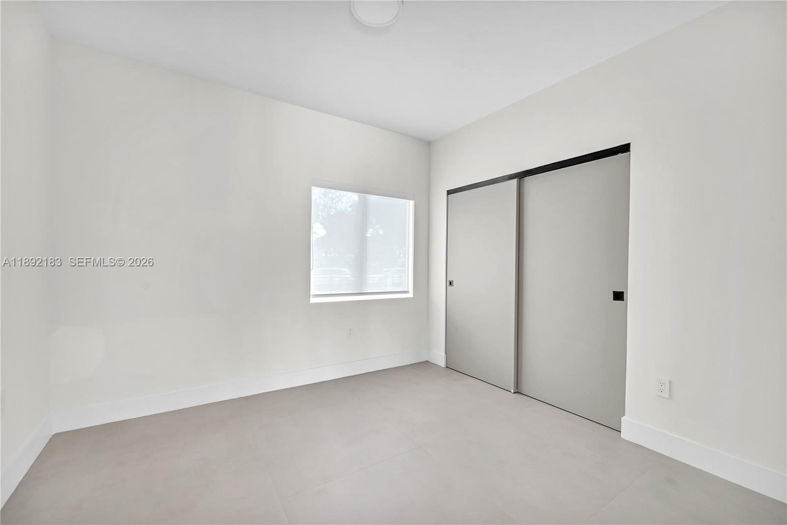 1200 Southwest 23rd Court Miami, FL 33135 - Photo 24 of 36 a view of an empty room with a window