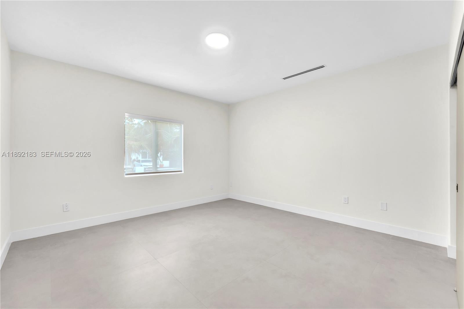 1200 Southwest 23rd Court Miami, FL 33135 - Photo 25 of 36 an empty room with a window