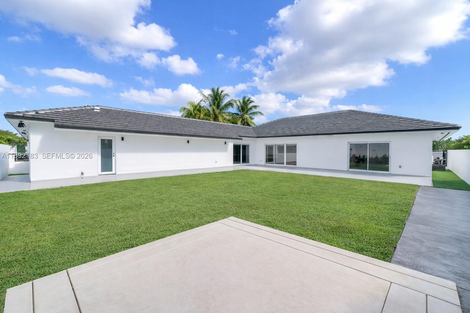 1200 Southwest 23rd Court Miami, FL 33135 - Photo 30 of 36 a front view of house with a garden