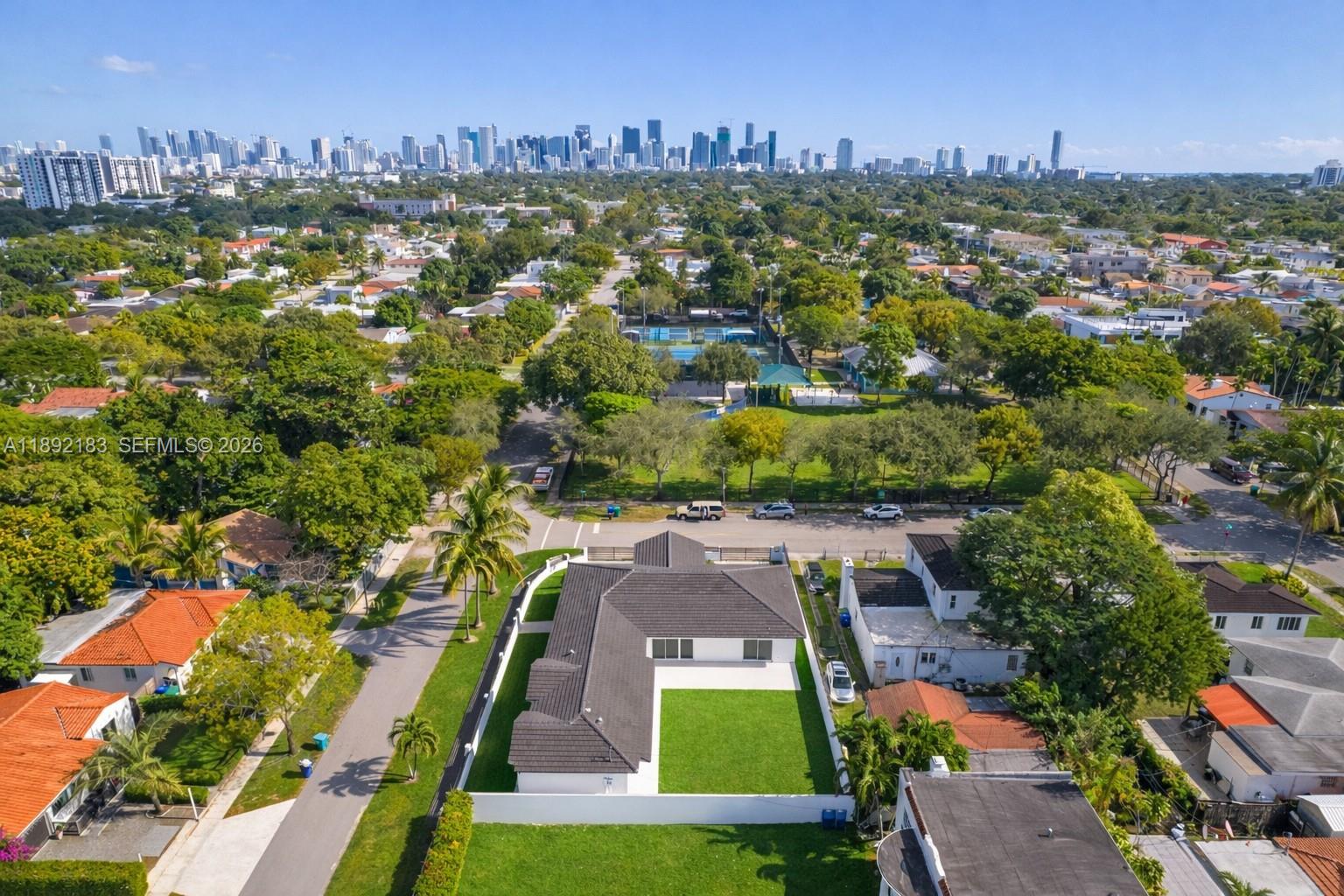 1200 Southwest 23rd Court Miami, FL 33135 - Photo 34 of 36 an aerial view of residential houses with outdoor space and trees