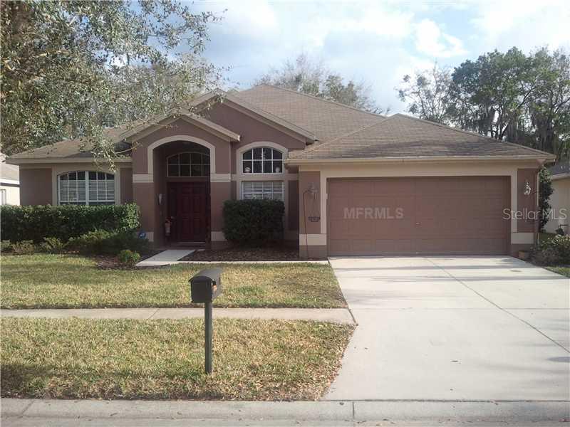17117 Falconridge Road Lithia, FL 33547 - Photo 1 of 1 a front view of a house with garden