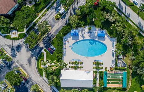 an aerial view of a house with outdoor space pool seating area and yard