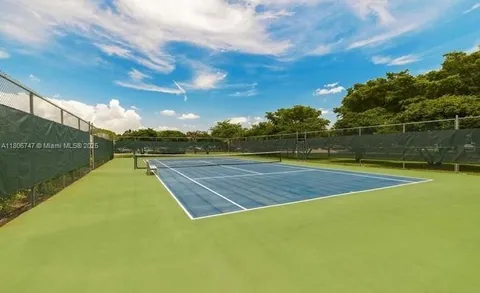 an aerial view of a house with garden space and swimming pool