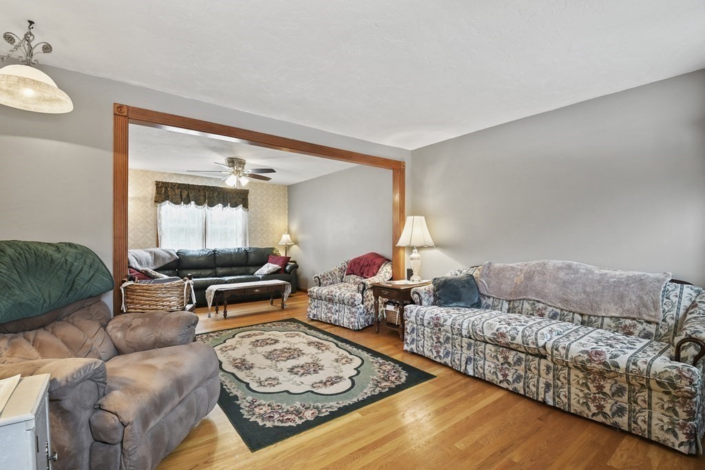 21 Merrill Road Sutton, MA 01590 - Photo 11 of 36 a living room with furniture and a couch