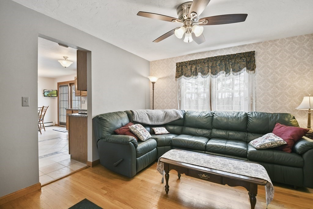 21 Merrill Road Sutton, MA 01590 - Photo 13 of 36 a living room with furniture and a large window