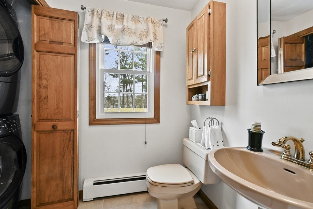 21 Merrill Road Sutton, MA 01590 - Photo 14 of 36 a bathroom with a sink toilet and shower