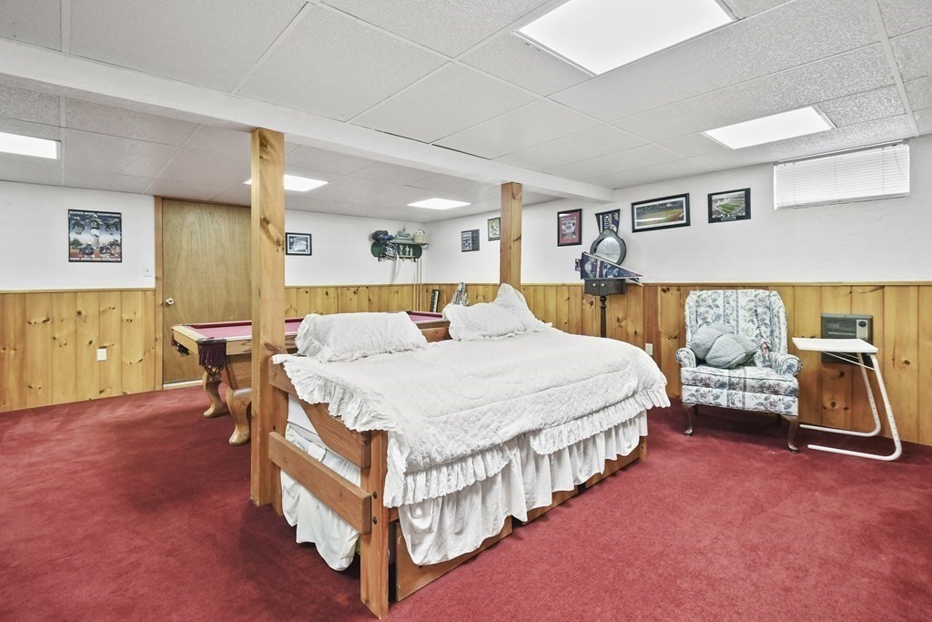 21 Merrill Road Sutton, MA 01590 - Photo 26 of 36 a bedroom with a bed and a walk in closet