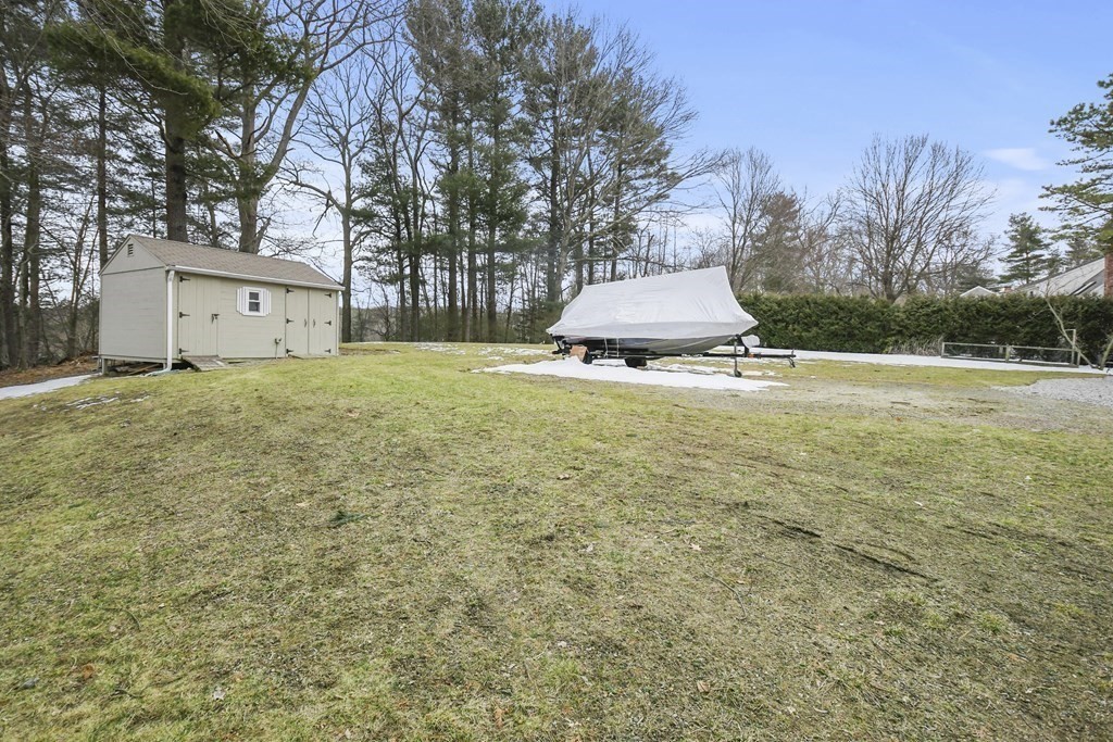 21 Merrill Road Sutton, MA 01590 - Photo 34 of 36 a view of a house with a yard and garage