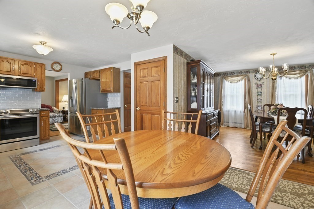 21 Merrill Road Sutton, MA 01590 - Photo 6 of 36 a view of a dining room with furniture