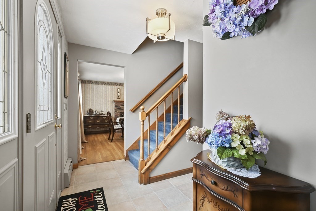 21 Merrill Road Sutton, MA 01590 - Photo 9 of 36 a front view of a house with wooden floor and a chandelier