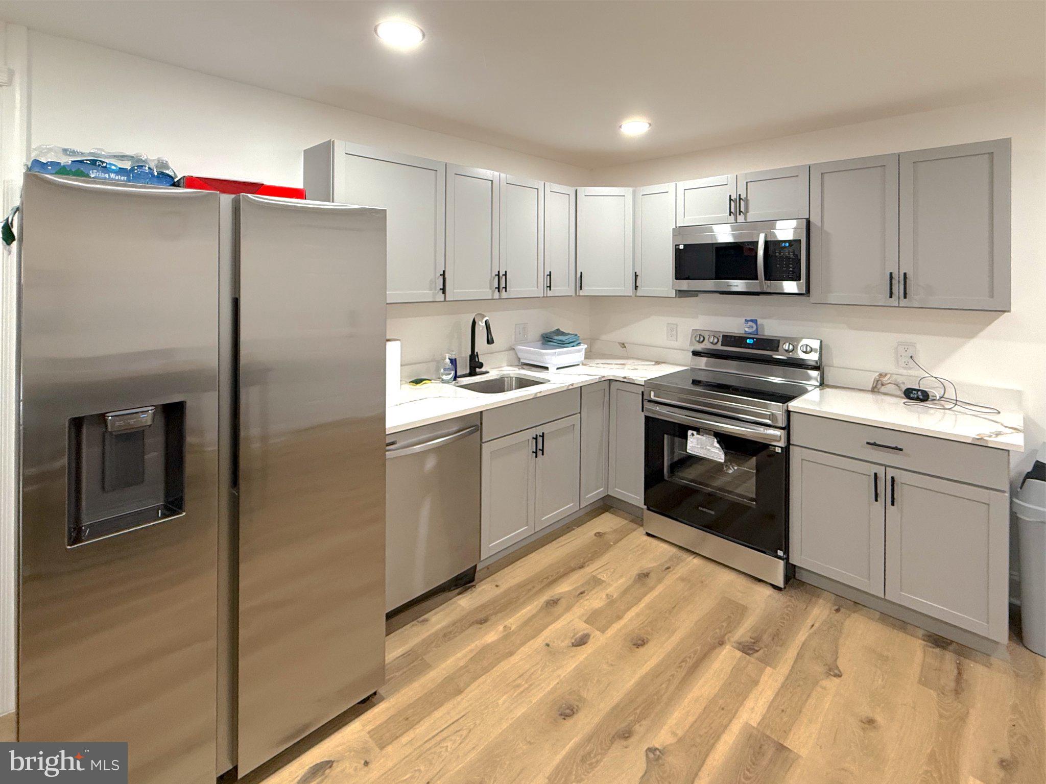 3703 6th Street, Unit 1 Baltimore, MD 21225 - Photo 7 of 12 Modern kitchen with sleek finishes.