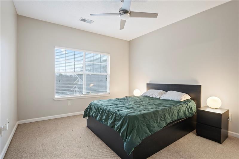 1150 Collier Road Northwest, Unit 3P Atlanta, GA 30318 - Photo 13 of 24 a bedroom with a bed and a window