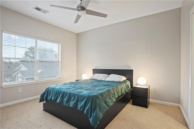 1150 Collier Road Northwest, Unit 3P Atlanta, GA 30318 - Photo 14 of 24 a bedroom with a bed and window