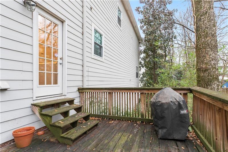 1150 Collier Road Northwest, Unit 3P Atlanta, GA 30318 - Photo 24 of 24 a view of a two chairs in the deck