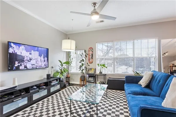 a living room with furniture and a large window