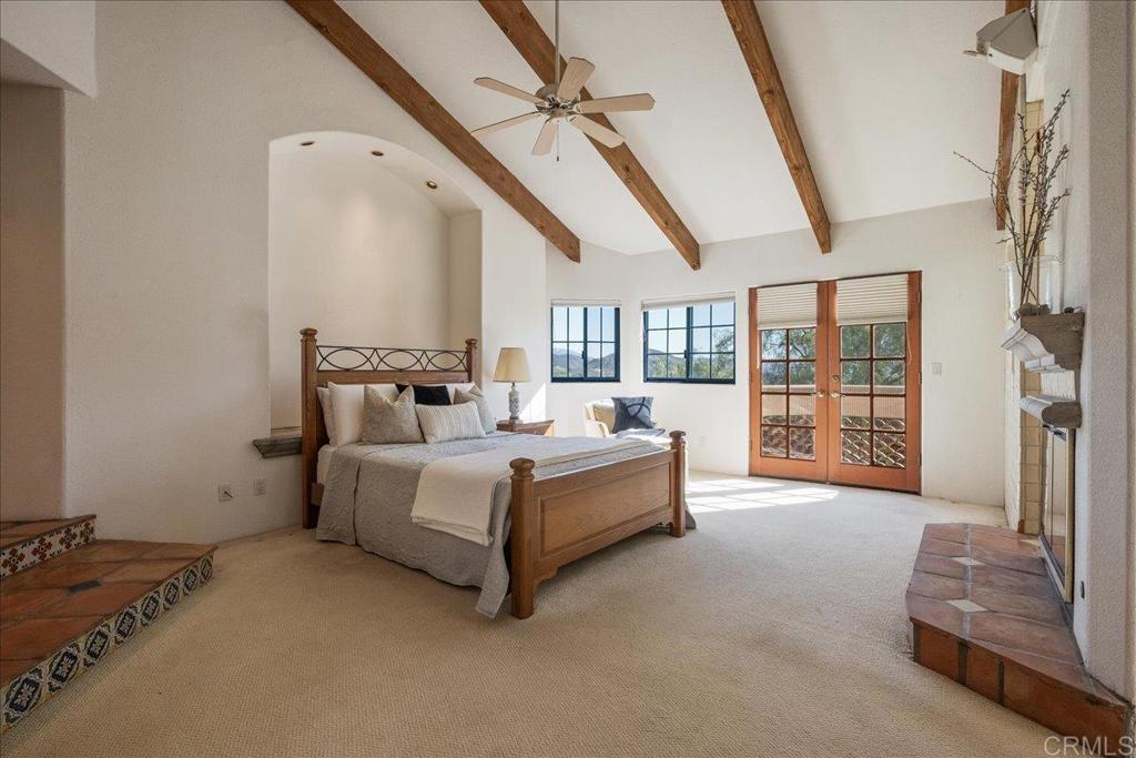 3577 Stonegate Place Fallbrook, CA 92028 - Photo 27 of 60 This Primary Bedroom has it all! A deck in which to relax, a fireplace, Walk In Mirrored Closets!